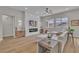 Bright living room showcasing modern furniture, fireplace and large windows at 10329 Bent Brook Pl, Las Vegas, NV 89134