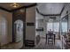 Open-concept dining room with tile flooring, access to kitchen and outside entry at 10553 Pine Pointe Ave # 201, Las Vegas, NV 89144