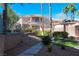Charming condo building featuring well-maintained landscaping, walking paths, and inviting outdoor spaces at 10553 Pine Pointe Ave # 201, Las Vegas, NV 89144