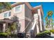Two-story condo exterior featuring a private balcony, landscaped surroundings, and an inviting entrance at 10553 Pine Pointe Ave # 201, Las Vegas, NV 89144