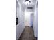 Hallway with tile floors, a plant niche, and an access panel in the ceiling at 10553 Pine Pointe Ave # 201, Las Vegas, NV 89144