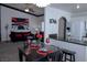 Open concept living room with dining area and modern decor at 10553 Pine Pointe Ave # 201, Las Vegas, NV 89144