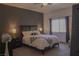 Bedroom with a queen size bed with zebra print ottoman and dark wood furnishings at 10553 Pine Pointe Ave # 201, Las Vegas, NV 89144