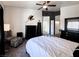 Comfortable main bedroom featuring dark furniture and neutral decor with a zebra print chair at 10553 Pine Pointe Ave # 201, Las Vegas, NV 89144