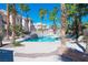 Stunning community pool featuring clear blue water, lounge chairs, and lush landscaping for relaxation at 10553 Pine Pointe Ave # 201, Las Vegas, NV 89144
