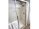 Tiled shower with sliding glass doors, offering a clean and modern look at 10553 Pine Pointe Ave # 201, Las Vegas, NV 89144