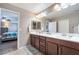 Bathroom includes dual sinks, ample counter space, and is connected to the main bedroom for convenience at 10568 Pelican Island Ave, Las Vegas, NV 89166