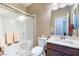 Clean bathroom featuring a walk-in shower, updated fixtures, and a modern vanity with ample counter space at 10568 Pelican Island Ave, Las Vegas, NV 89166
