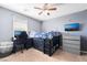 This bedroom features a ceiling fan, a loft bed, a desk, and a TV at 10568 Pelican Island Ave, Las Vegas, NV 89166