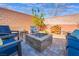 Cozy backyard fire pit area with comfortable seating, ideal for gatherings at 10568 Pelican Island Ave, Las Vegas, NV 89166