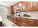Well-lit kitchen featuring modern appliances, granite countertops and abundant cabinet storage at 10568 Pelican Island Ave, Las Vegas, NV 89166