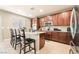 Modern kitchen with granite countertops, stainless steel appliances, and ample cabinet space at 10568 Pelican Island Ave, Las Vegas, NV 89166