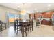 Well-equipped kitchen with modern appliances, a dining area, and access to the outdoor patio at 10568 Pelican Island Ave, Las Vegas, NV 89166