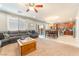 Spacious living room leading to the dining area and kitchen, creating an open and airy feel at 10568 Pelican Island Ave, Las Vegas, NV 89166
