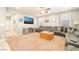 Comfortable living room featuring plush seating, a large television, and neutral carpeting at 10568 Pelican Island Ave, Las Vegas, NV 89166