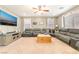 Inviting living room with carpet flooring, TV, and plenty of seating for Gathering and guests at 10568 Pelican Island Ave, Las Vegas, NV 89166