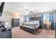 Comfortable main bedroom with stylish furniture, soft carpet, and natural light, a relaxing retreat at 10568 Pelican Island Ave, Las Vegas, NV 89166