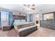 Inviting main bedroom with ample furniture, a large bed, and windows, offering a peaceful sanctuary at 10568 Pelican Island Ave, Las Vegas, NV 89166