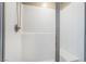 Clean, modern shower with white subway tiles, a built-in seat, and a sleek glass door at 10568 Pelican Island Ave, Las Vegas, NV 89166