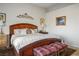 Inviting bedroom with a large bed, patterned bedding, and elegant decorative accents at 10716 Bennington Ct, Las Vegas, NV 89134