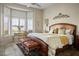 Comfortable bedroom featuring a bay window with shutter and a cozy sitting area at 10716 Bennington Ct, Las Vegas, NV 89134