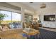 Cozy living room featuring stylish furniture, sliding glass doors, and outside patio at 10716 Bennington Ct, Las Vegas, NV 89134