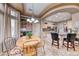 Spacious eat-in kitchen features curved island with bar seating and natural light at 10917 Mcneese Ct, Las Vegas, NV 89134