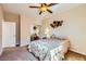 This bedroom features neutral walls, carpet floors, and a ceiling fan for added comfort at 1178 Yellow Orchid St, Henderson, NV 89002