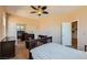 This bedroom features neutral walls, carpet floors, and a ceiling fan for added comfort at 1178 Yellow Orchid St, Henderson, NV 89002