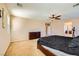 Spacious bedroom features a ceiling fan, dresser, and access to the ensuite bathroom at 1178 Yellow Orchid St, Henderson, NV 89002