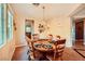 Dining room featuring a wooden table set for six, complete with a chandelier at 1178 Yellow Orchid St, Henderson, NV 89002
