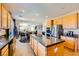 Spacious kitchen featuring stainless steel appliances, granite countertops, and an island, seamlessly connects to living area at 1178 Yellow Orchid St, Henderson, NV 89002