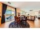 Open living and dining area with large sliding door to the backyard at 1178 Yellow Orchid St, Henderson, NV 89002