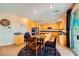 Open living and dining area near the kitchen with access to the backyard at 1178 Yellow Orchid St, Henderson, NV 89002