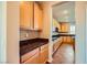 Pantry with granite counters and wood cabinets near the kitchen at 1178 Yellow Orchid St, Henderson, NV 89002