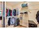 Well-organized walk-in closet with wire shelving, hanging clothes, and storage solutions at 1178 Yellow Orchid St, Henderson, NV 89002