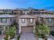This is an aerial view of a charming two-story home featuring an attached garage and mountain views at 12521 Lylan Ridge St, Las Vegas, NV 89138