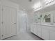 Bathroom featuring double vanity sinks, sleek cabinetry, and a glass enclosed shower at 12521 Lylan Ridge St, Las Vegas, NV 89138