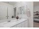 Double sink vanity with white quartz countertops at 12521 Lylan Ridge St, Las Vegas, NV 89138