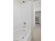 White tiled bathtub and shower with chrome fixtures at 12521 Lylan Ridge St, Las Vegas, NV 89138