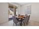 This is a stylish dining room with neutral paint and a sliding glass door leading to the backyard at 12521 Lylan Ridge St, Las Vegas, NV 89138