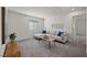 Cozy living room with plush seating, soft carpet, and bright natural light at 12521 Lylan Ridge St, Las Vegas, NV 89138