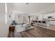 Spacious living room with wood floors, neutral paint, modern furniture and lots of natural light at 12521 Lylan Ridge St, Las Vegas, NV 89138