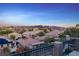 Scenic aerial view of a neighborhood with mountains in the distance at sunset at 1436 Via Merano St, Henderson, NV 89052