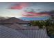 Picturesque view from a rooftop highlighting the city skyline and palm trees at 1436 Via Merano St, Henderson, NV 89052