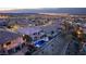 Aerial view of homes at dusk, showcasing the pool and landscaping at 1436 Via Merano St, Henderson, NV 89052