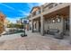Expansive patio with a pool, basketball hoop, and comfortable outdoor seating at 1436 Via Merano St, Henderson, NV 89052