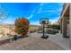Stone patio featuring a basketball hoop, a rock spa and distant mountain views at 1436 Via Merano St, Henderson, NV 89052