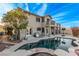 Resort-style backyard with sparkling pool, spa, covered patio, and ample space for outdoor entertaining at 1436 Via Merano St, Henderson, NV 89052