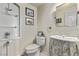 Cozy powder room with a decorative vanity and stylish accents at 1436 Via Merano St, Henderson, NV 89052